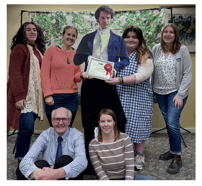 staff posing with mr darcy