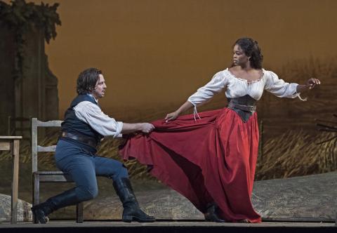 Nemorino touches Adina's dress